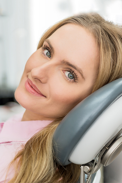 A relaxed blonde woman in the dentist's chair