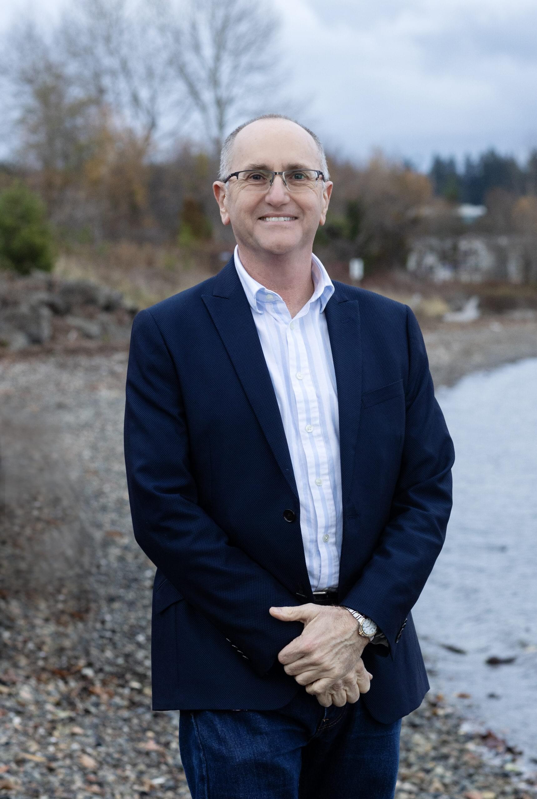 Meet our dentist in Bremerton, WA Dr. Michael Mitchell smiling at the beach