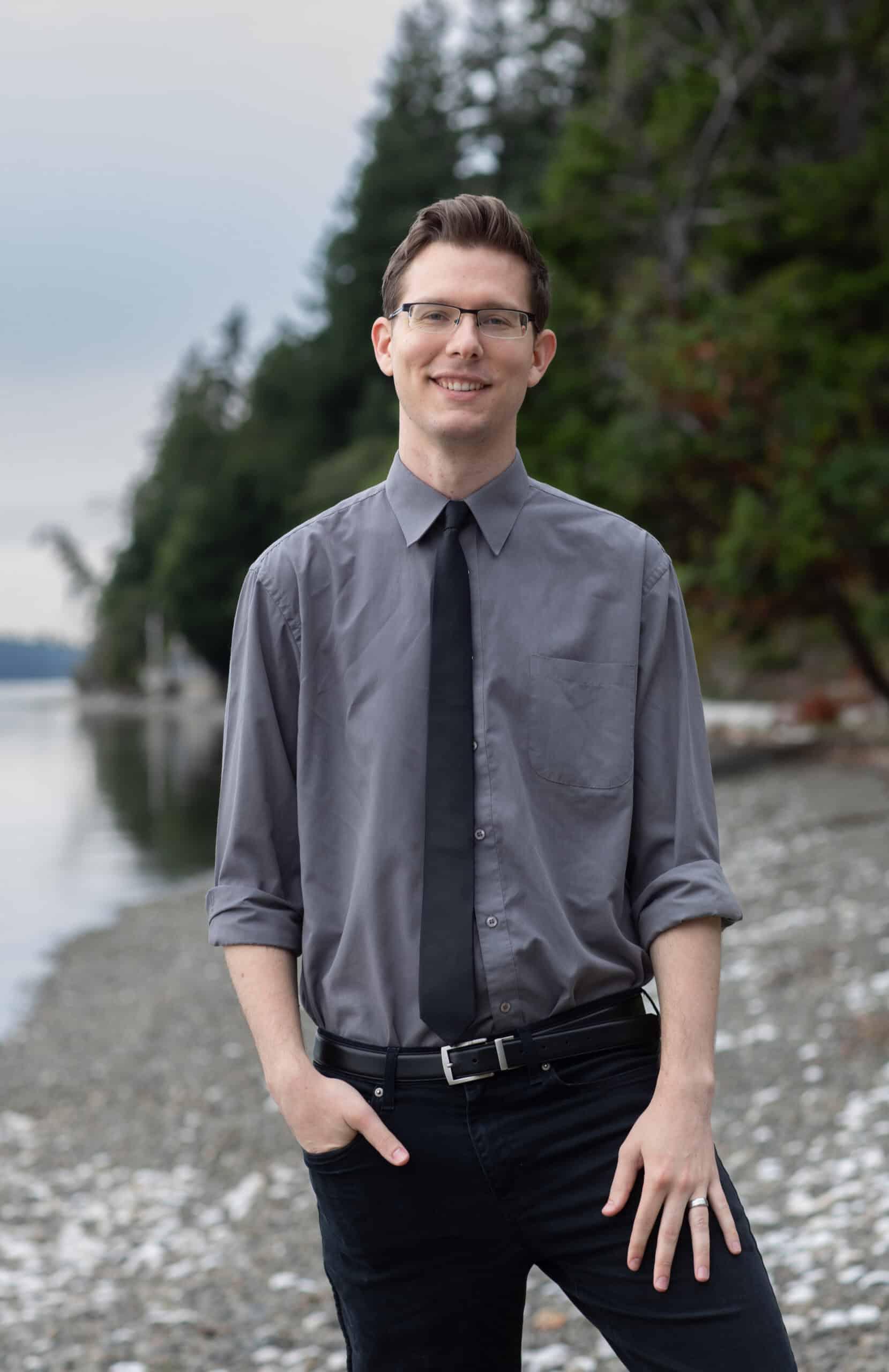 Dr. Anthony Kollmann smiling on the beach